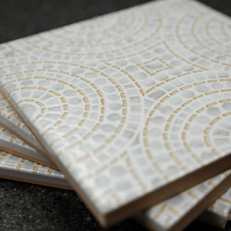 Push the boundaries of design with On The Edge, handmade decorative tile that blends Mediterranean charm with encaustic artistry.  Its eclectic patterns and transitional versatility make it the perfect choice for those who love bold, expressive interiors