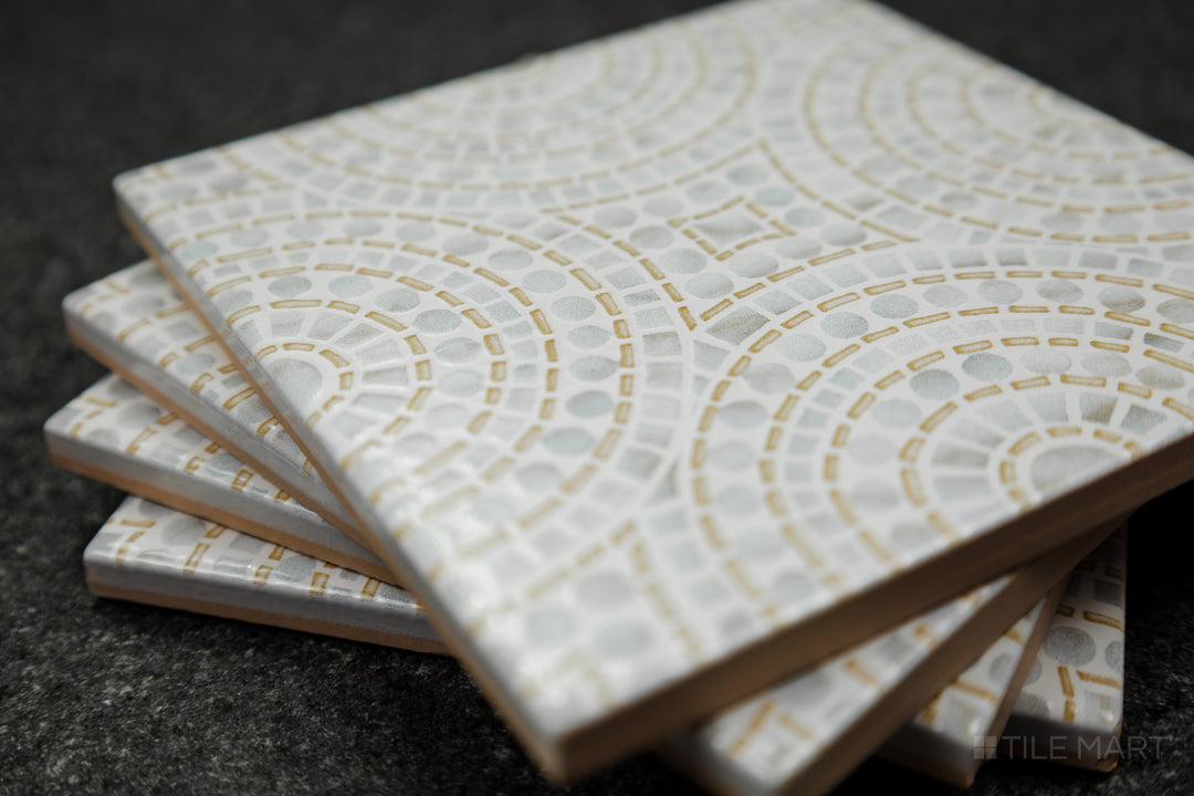 Push the boundaries of design with On The Edge, handmade decorative tile that blends Mediterranean charm with encaustic artistry.  Its eclectic patterns and transitional versatility make it the perfect choice for those who love bold, expressive interiors