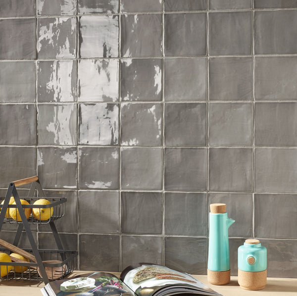Elevate your space with the artisanal charm of St.  Tropez Zellige decorative tile. Featuring a handcrafted texture and a luminous glossy finish, this tile adds character and depth to any setting
