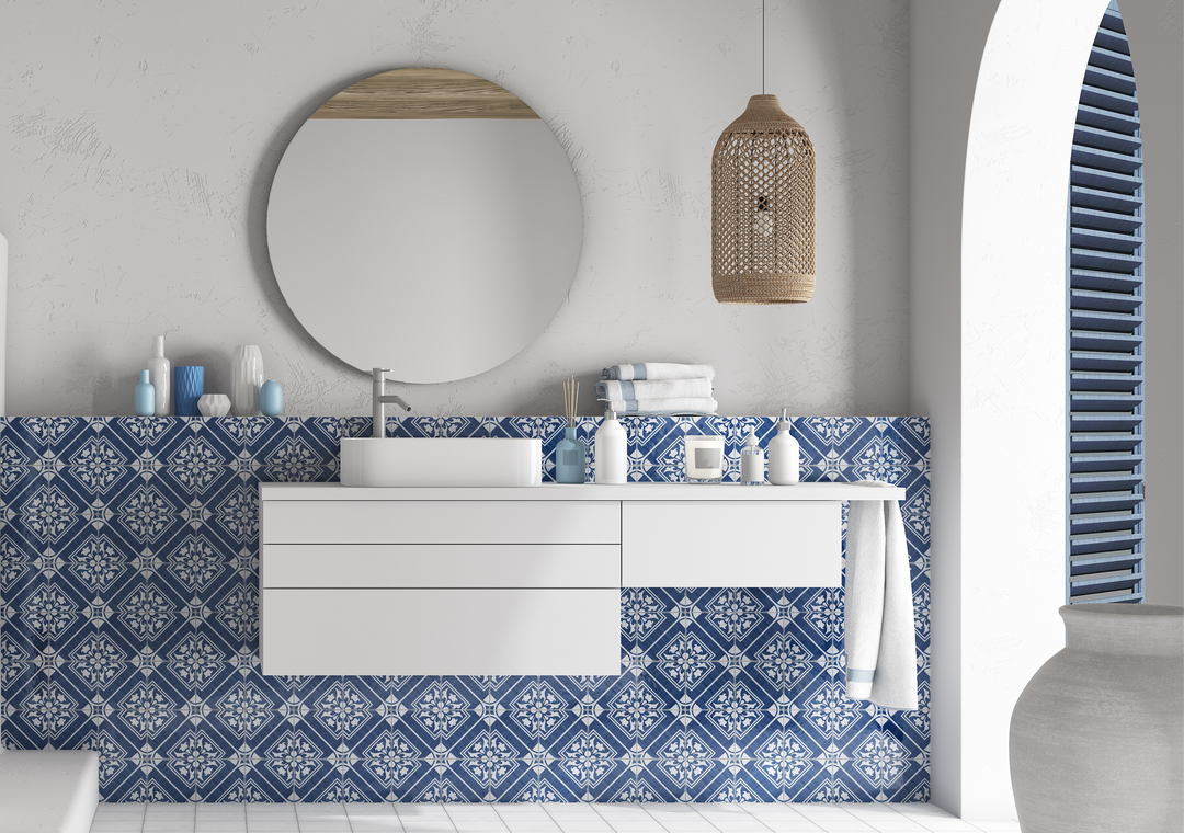 The Andratx tile collection captures the essence of traditional Mallorca textiles, featuring decorative porcelain tiles with intricate patterns in navy, green, and charcoal.