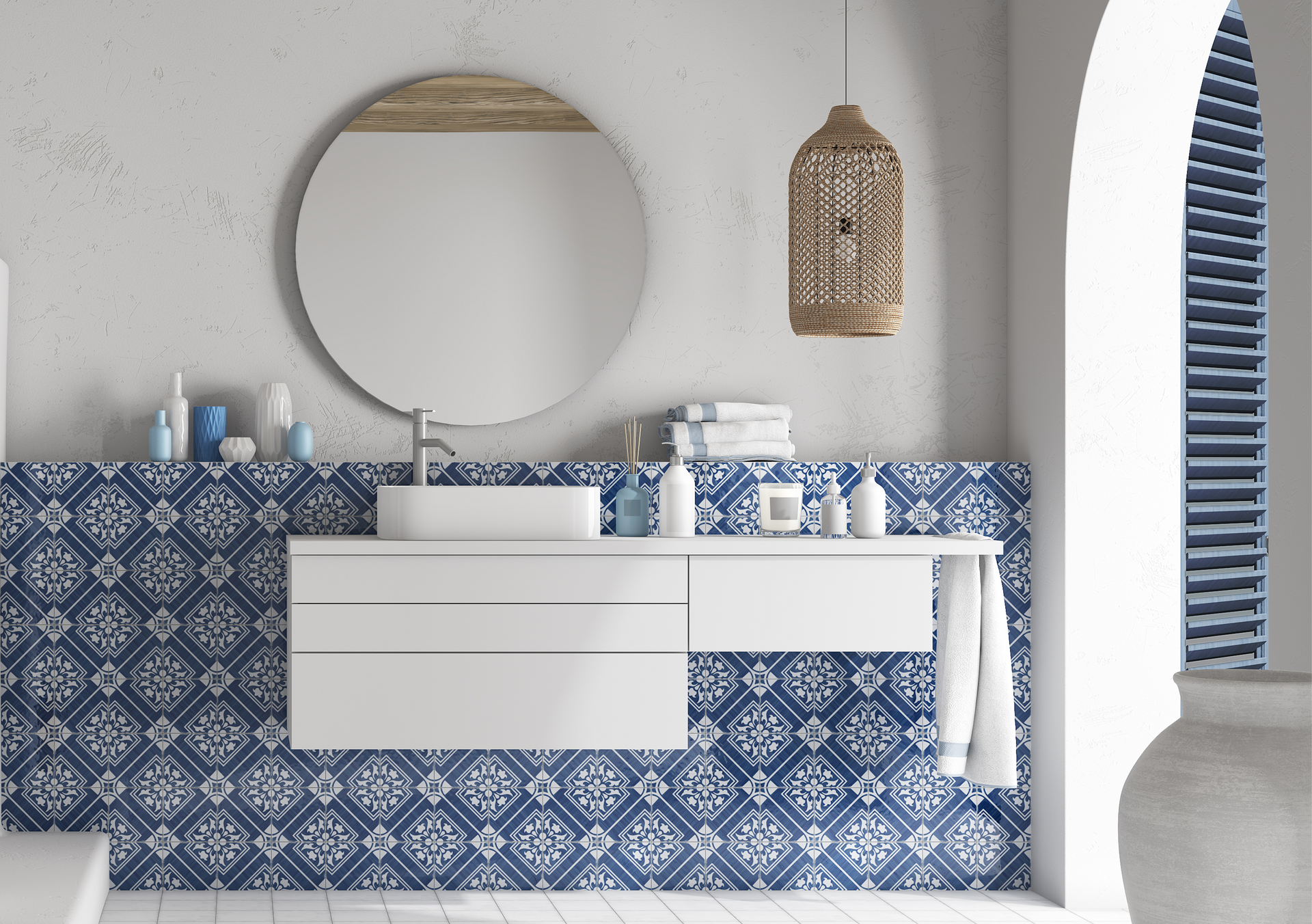 The Andratx tile collection captures the essence of traditional Mallorca textiles, featuring decorative porcelain tiles with intricate patterns in navy, green, and charcoal.