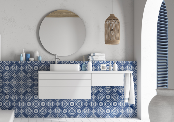 The Andratx tile collection captures the essence of traditional Mallorca textiles, featuring decorative porcelain tiles with intricate patterns in navy, green, and charcoal.