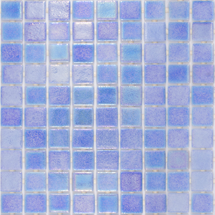 Cielo Azul’s glossy glass mosaic in deep oceanic blue presents a shimmering surface, displayed from above to showcase its intricate square arrangement.