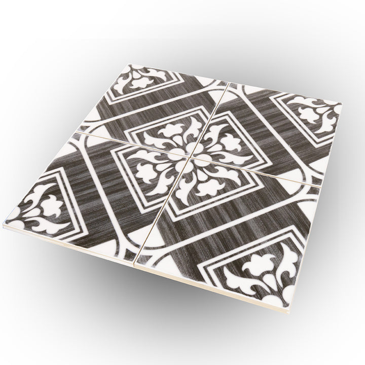 From a close-up perspective, the Andratx Telmo Charcoal 6x6 glossy porcelain tile reveals its smooth, polished surface, enhancing the richness of its dark charcoal finish.