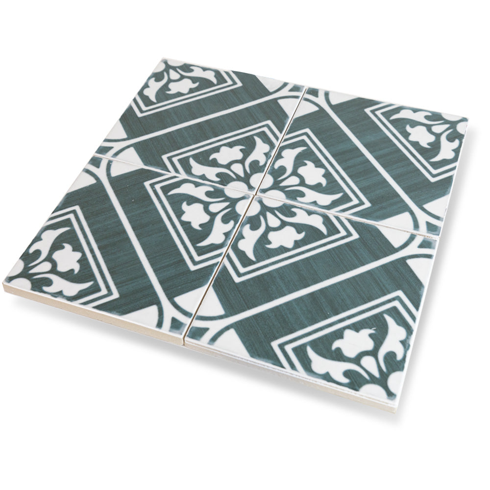 A rich green hue shines in this close-up of Andratx Telmo Green 6x6 glossy porcelain tile, highlighting its reflective glaze and smooth surface.