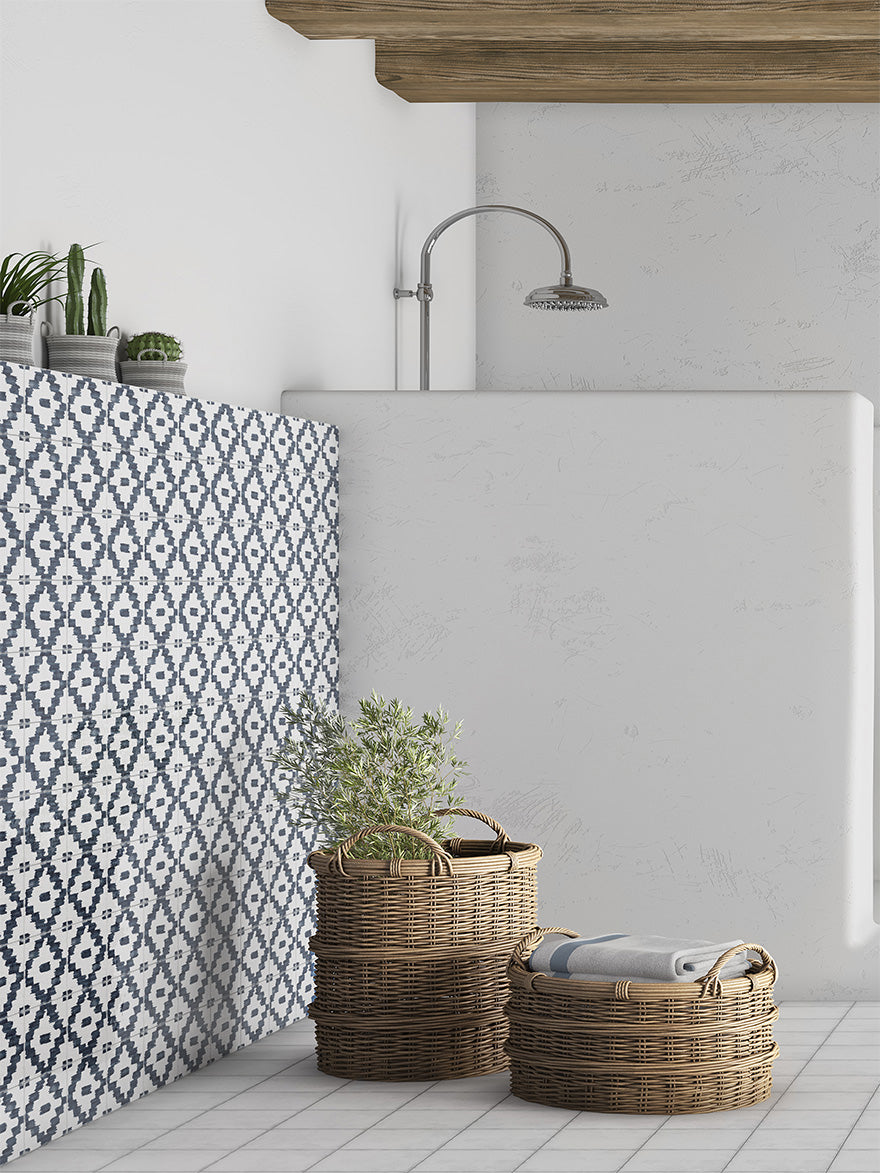 A bold and sophisticated interior accented by Andratx Tramontana Charcoal 6X6 glossy porcelain tiles, where deep charcoal shades enhance the ambiance with modern, moody elegance.