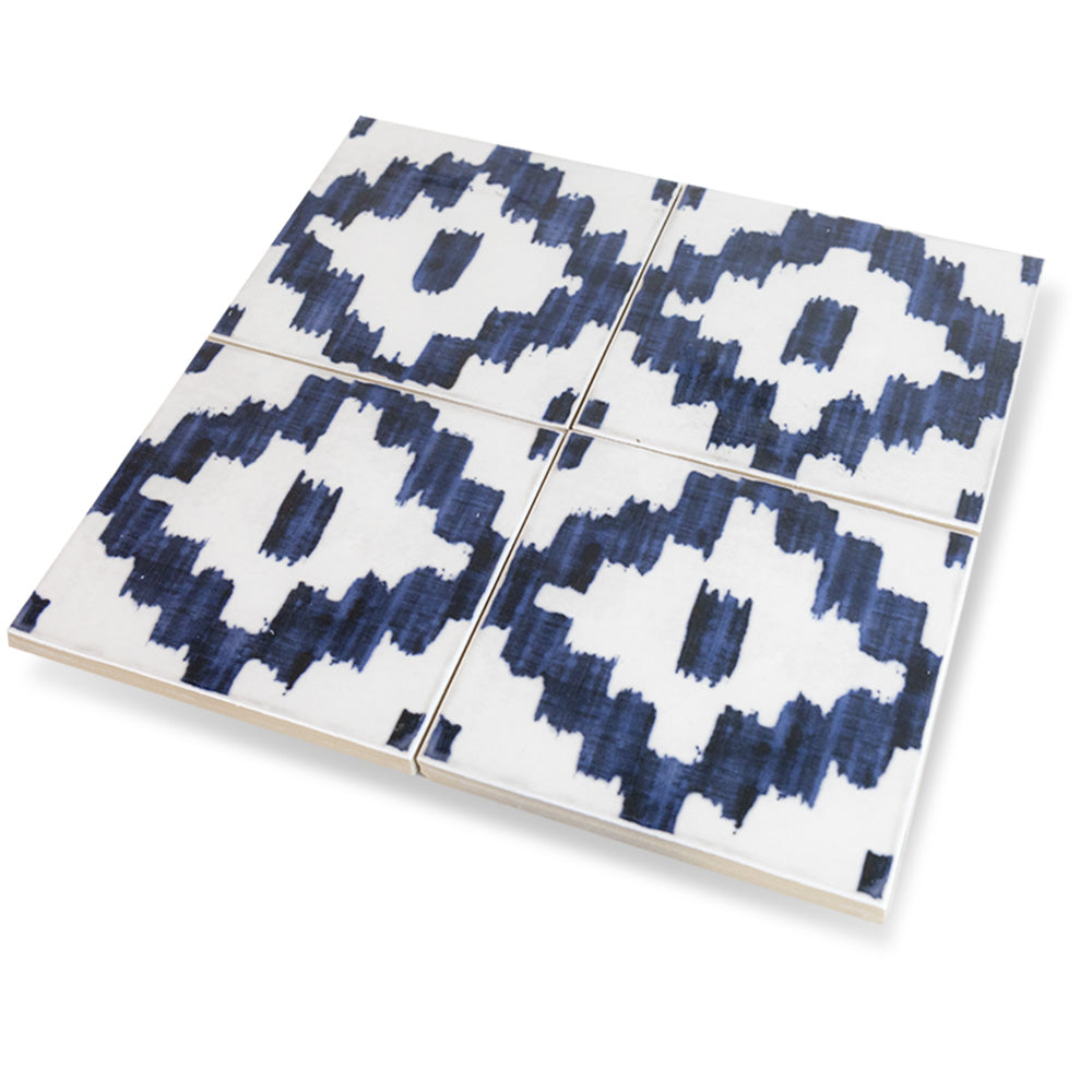 A deep navy tone with a high-gloss finish is displayed in this detailed macro shot of Andratx Tramontana Navy 6x6 glossy porcelain tile, reflecting subtle light variations.