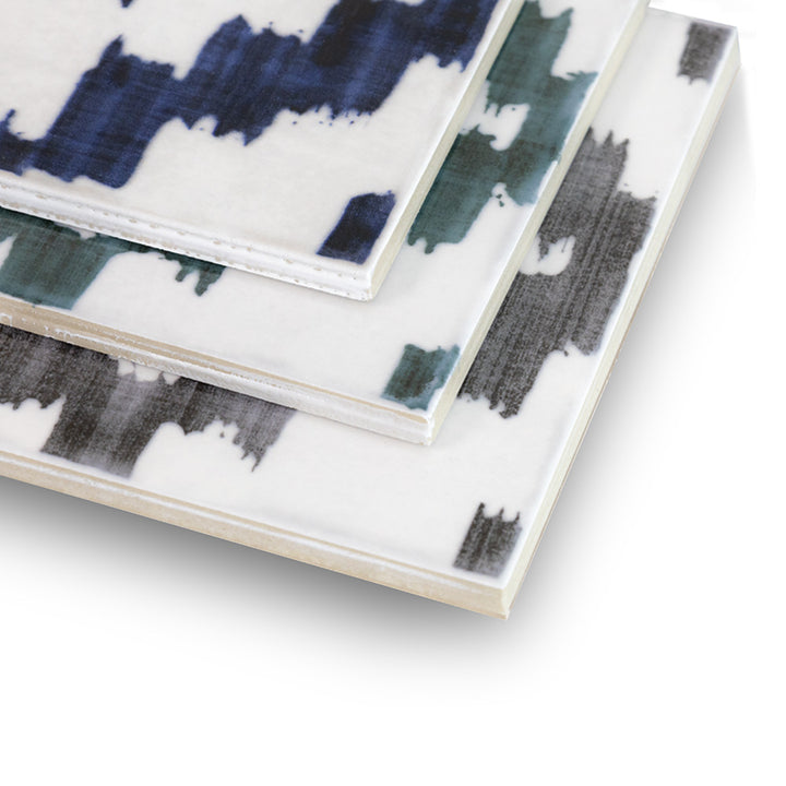 Angled shot of Andratx Tramontana Navy 6x6 glossy porcelain tile, focusing on the deep blue color, glossy reflection, and precisely cut edges meeting at the corner.