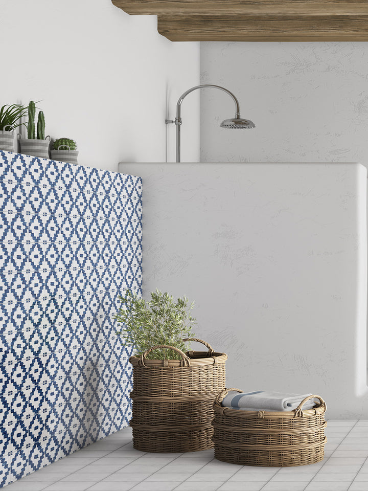 A stylish and contemporary room scene featuring Andratx Tramontana Navy 6X6 glossy porcelain tiles, where deep blue tones and a reflective finish create a sense of luxury and depth.