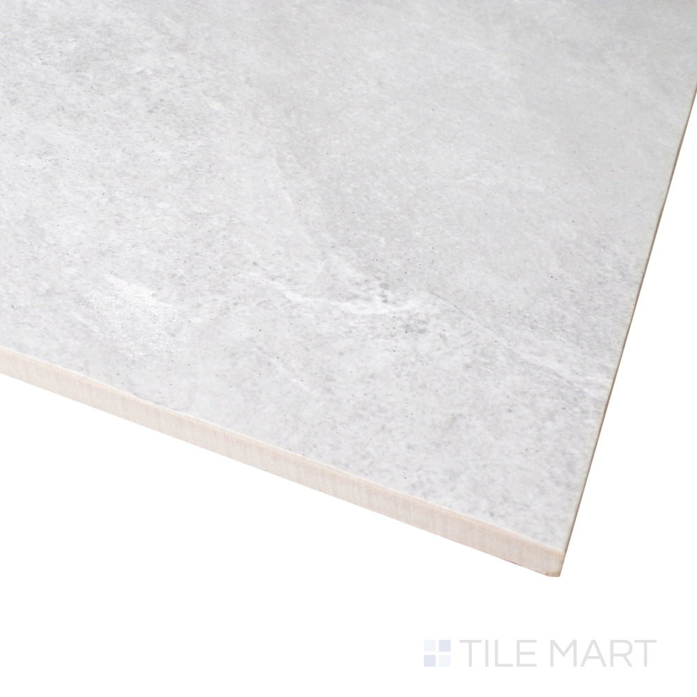 A smooth, neutral-toned surface is captured in this close-up shot of Ash Silver 12x24 matte porcelain tile, showcasing its fine matte texture.