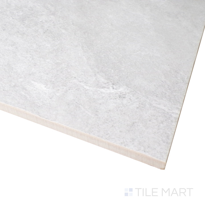 A smooth, neutral-toned surface is captured in this close-up shot of Ash Silver 12x24 matte porcelain tile, showcasing its fine matte texture.