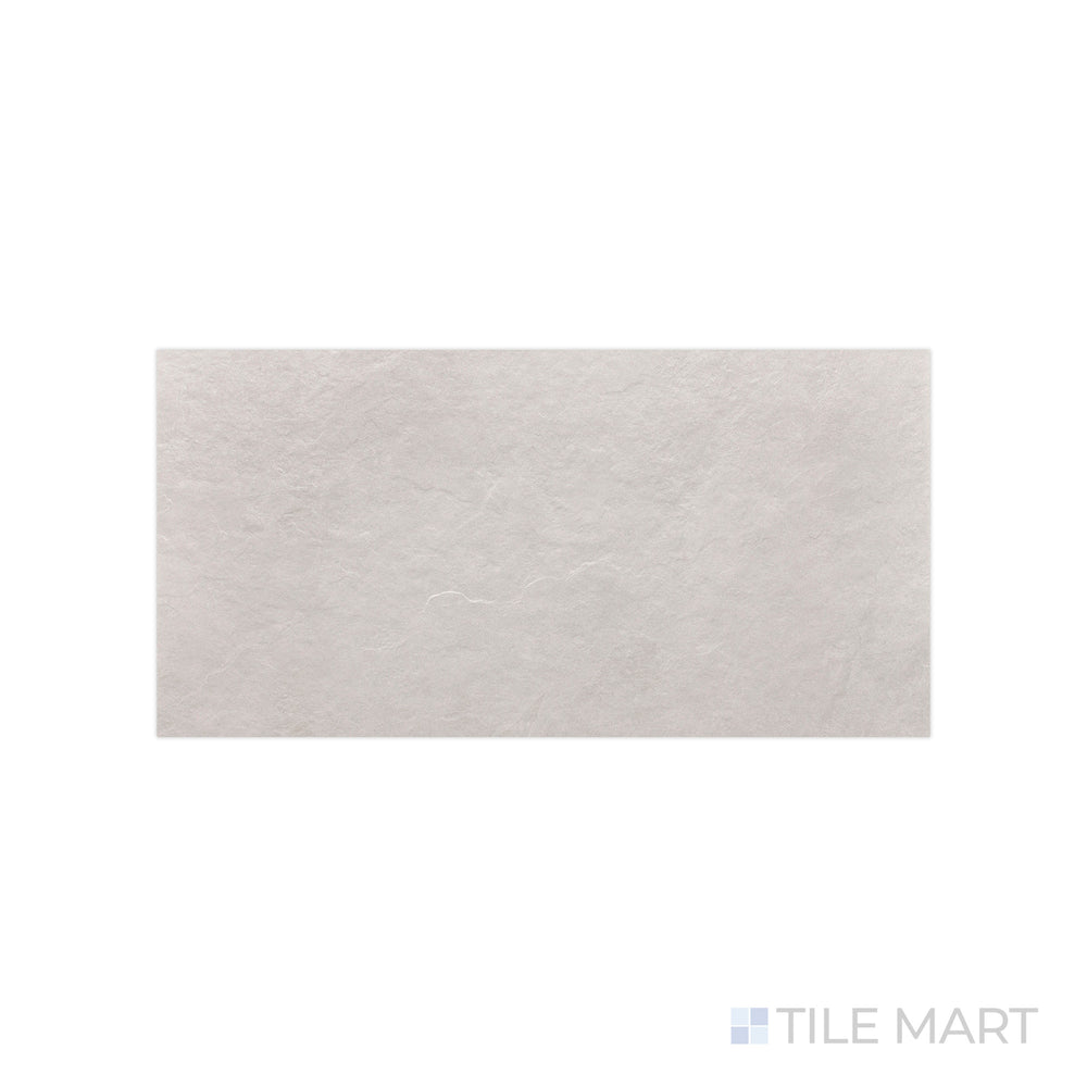 A crisp white finish with a soft matte effect is detailed in this close-up of Ash White 12x24 matte porcelain tile, emphasizing its subtle surface texture.