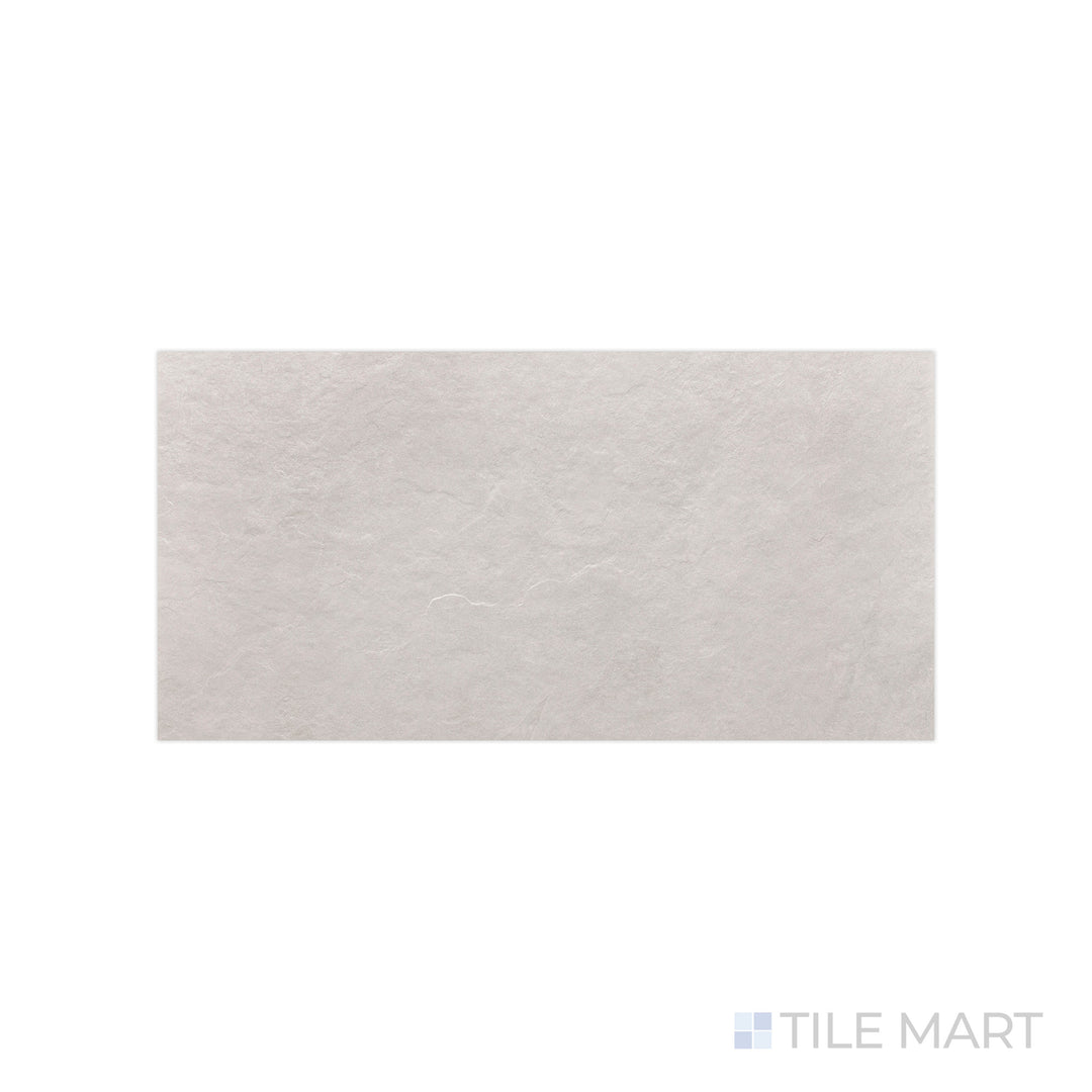 A crisp white finish with a soft matte effect is detailed in this close-up of Ash White 12x24 matte porcelain tile, emphasizing its subtle surface texture.