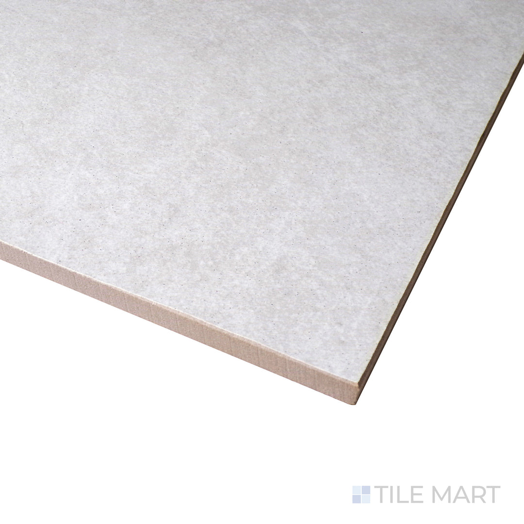 Corner perspective of Ash White 12x24 matte porcelain tile, showing off its bright white tone, subtle matte finish, and precisely aligned edges.