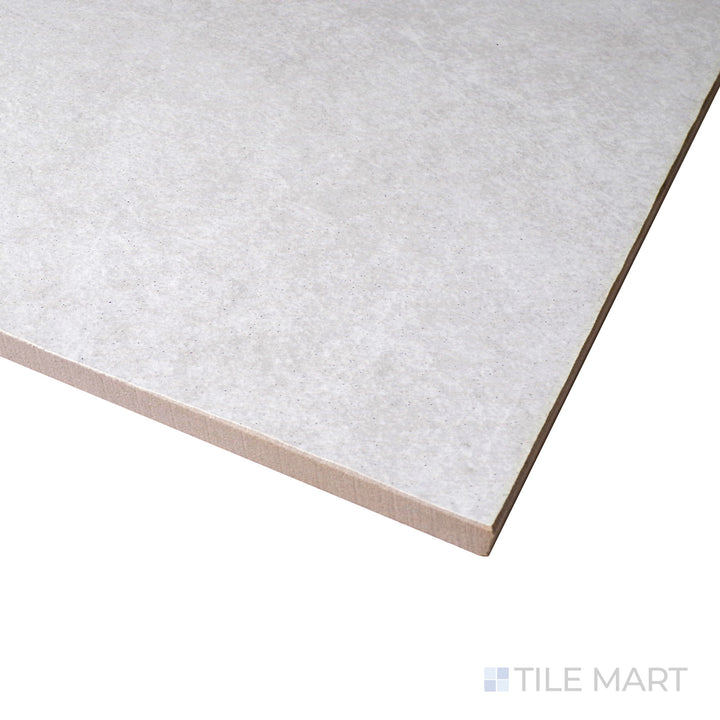 Corner perspective of Ash White 12x24 matte porcelain tile, showing off its bright white tone, subtle matte finish, and precisely aligned edges.