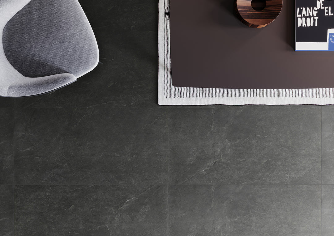 A contemporary space featuring Ash Black 24X48 matte porcelain tiles, where deep, sophisticated tones enhance the environment with a bold yet timeless appeal.