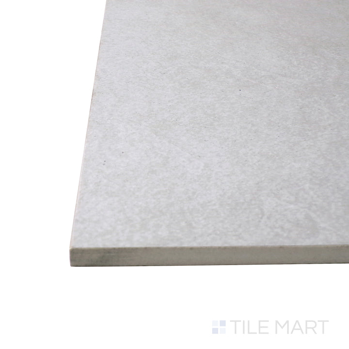 Captured from a corner angle, the Ash Silver 24x48 matte porcelain tile showcases its sleek silver-gray hue and soft matte texture, delivering a modern and industrial-inspired aesthetic.