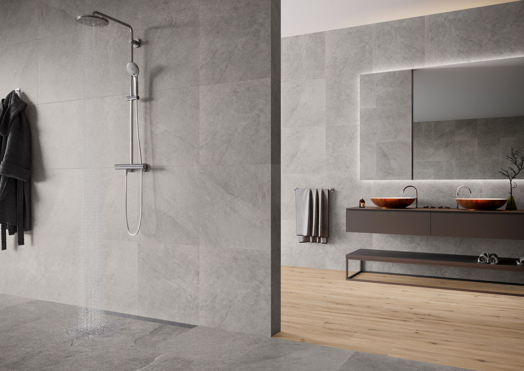 An elegant lifestyle setting with Ash Silver 24X48 matte porcelain tiles, reflecting subtle light tones that create a refined and airy atmosphere.