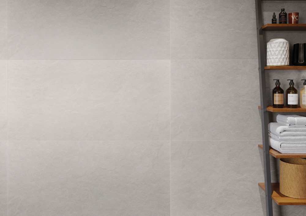 A serene and modern space highlighted by Ash White 24X48 matte porcelain tiles, delivering a crisp, clean aesthetic with a touch of minimalist charm.