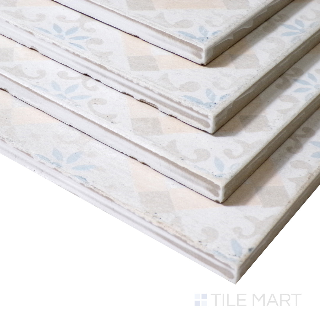 An angled shot highlights the intricate details of this Barcelona-inspired decorative tile, enhancing its artistic matte surface.