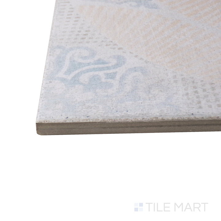 Captured from a corner angle, the Barcelona Décor Guell 6x6 matte porcelain tile showcases its ornate design and muted tones, offering a classic yet artistic look.