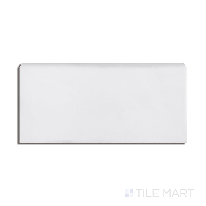 Top-down view of Basics White 3X6 Glossy Ceramic Bullnose, presenting a smooth white tone with a rounded edge and glossy finish.