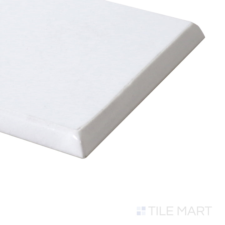 A close-up angle showcases the glossy bullnose detail, highlighting the smooth, curved edge of this white ceramic tile.