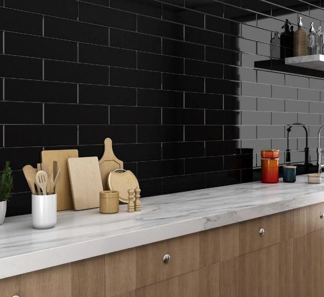 A bold and contemporary space highlighted by Basics Black 3X12 glossy ceramic tiles, bringing a dramatic and refined contrast to the design.