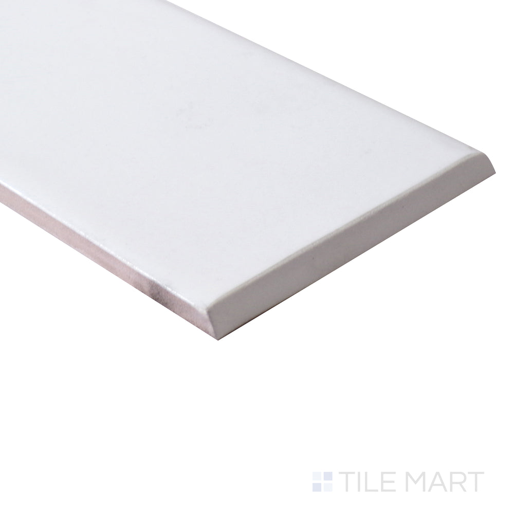 The curved bullnose edge is accentuated from an angle, blending seamlessly with the matte white ceramic surface.