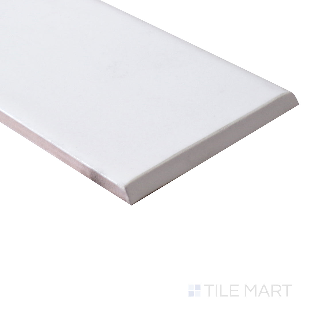 The curved bullnose edge is accentuated from an angle, blending seamlessly with the matte white ceramic surface.