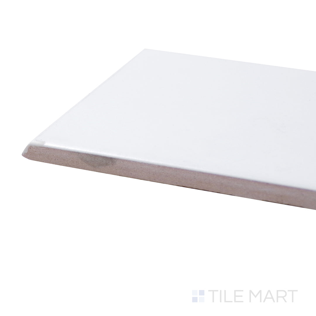 Captured from a corner angle, the Basics White 3x6 matte ceramic bullnose tile showcases its clean, matte finish with a rounded edge, providing a refined finishing touch.