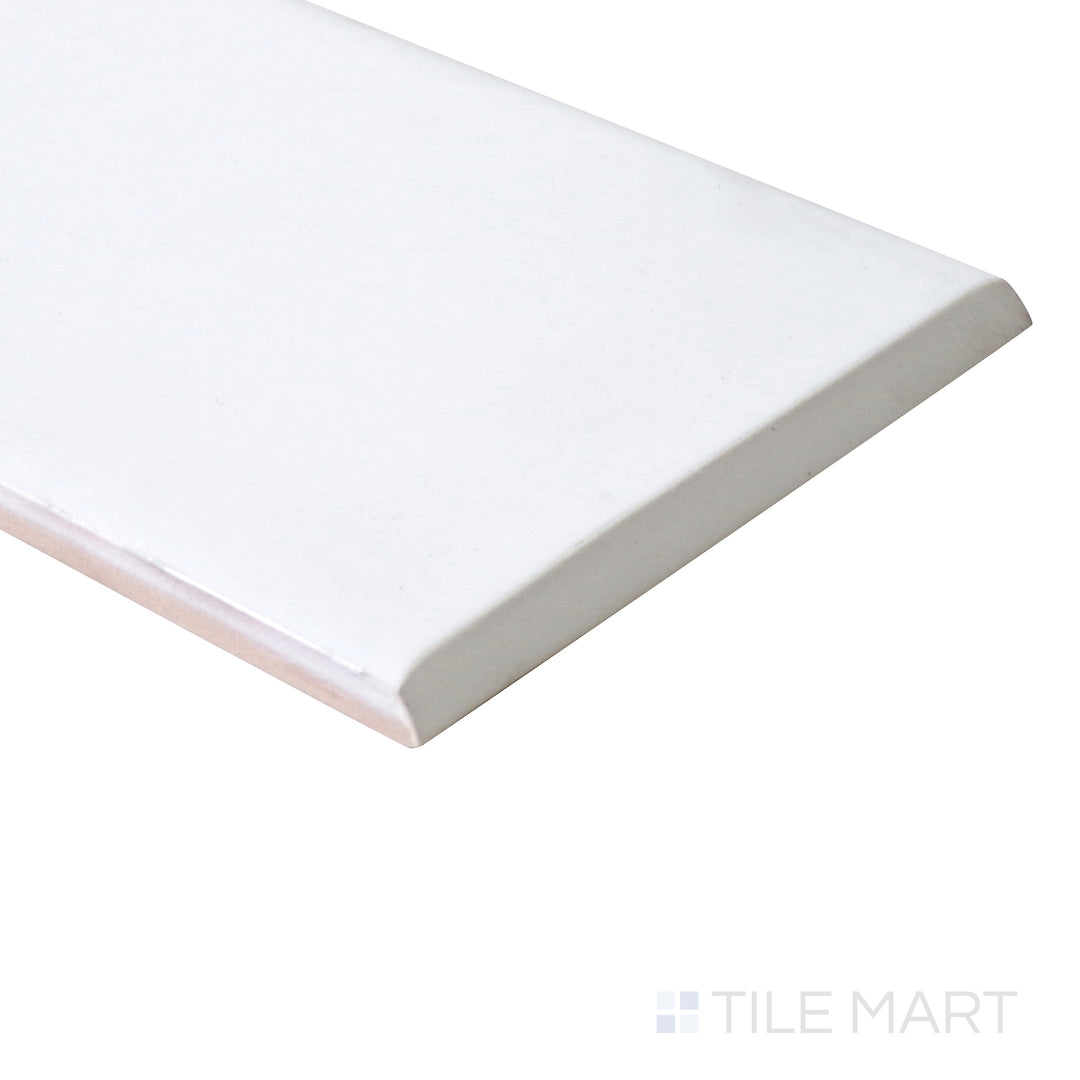 A polished bullnose detail is captured at an angle, creating a smooth and refined transition on this matte ceramic tile.