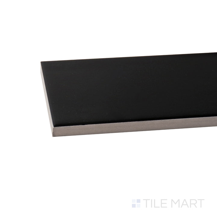 A corner shot of the Basics Black 3x12 matte ceramic tile highlights its deep black shade and smooth matte surface, adding a bold yet understated elegance to walls and floors.