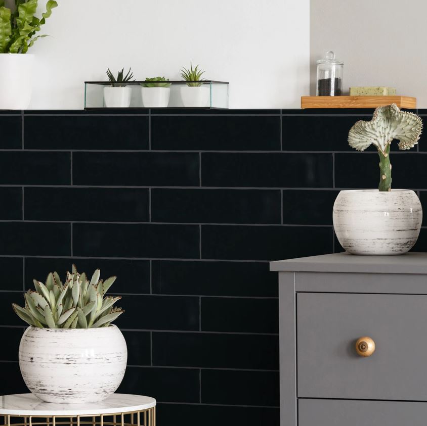 A refined and sophisticated ambiance complemented by Basics Black 3X12 matte ceramic tiles, where deep black hues create a bold and modern statement.