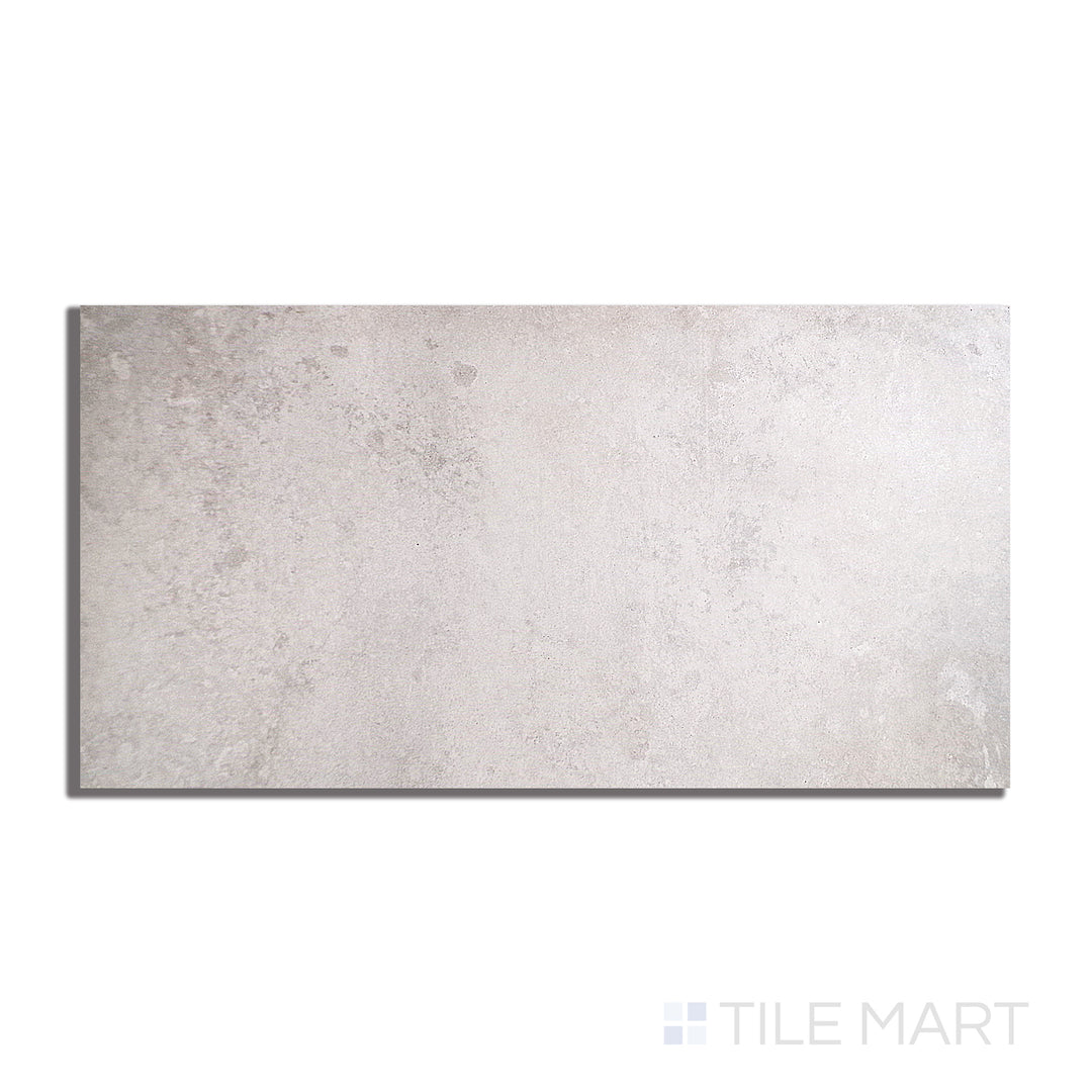 Flat lay of Brooklyn Cemento Argent 24X48 Honed Porcelain, highlighting its sophisticated grey hue and soft honed texture for contemporary spaces.