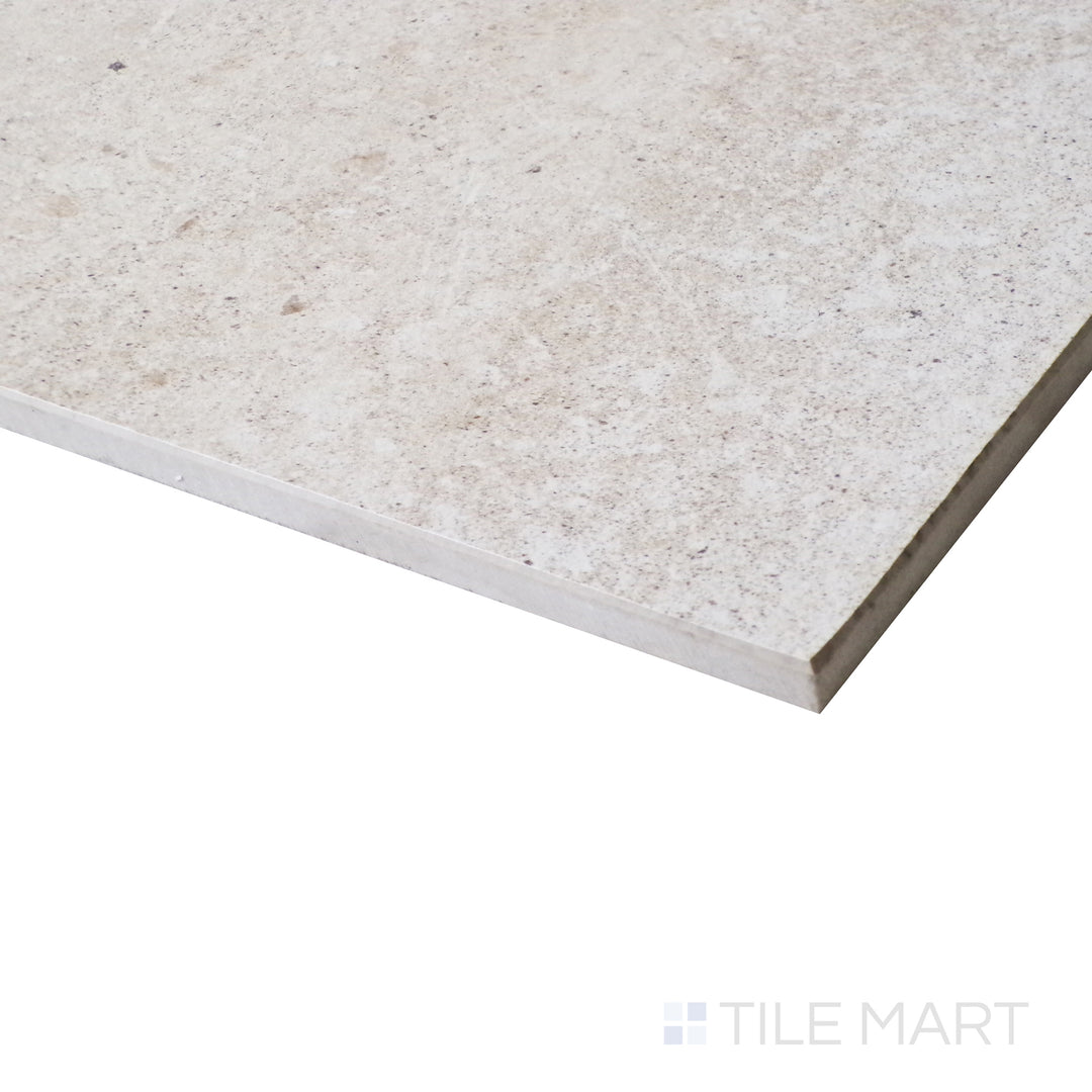 An angled close-up showcases the warm sand tones, with a honed finish that enhances the natural cement-inspired surface.