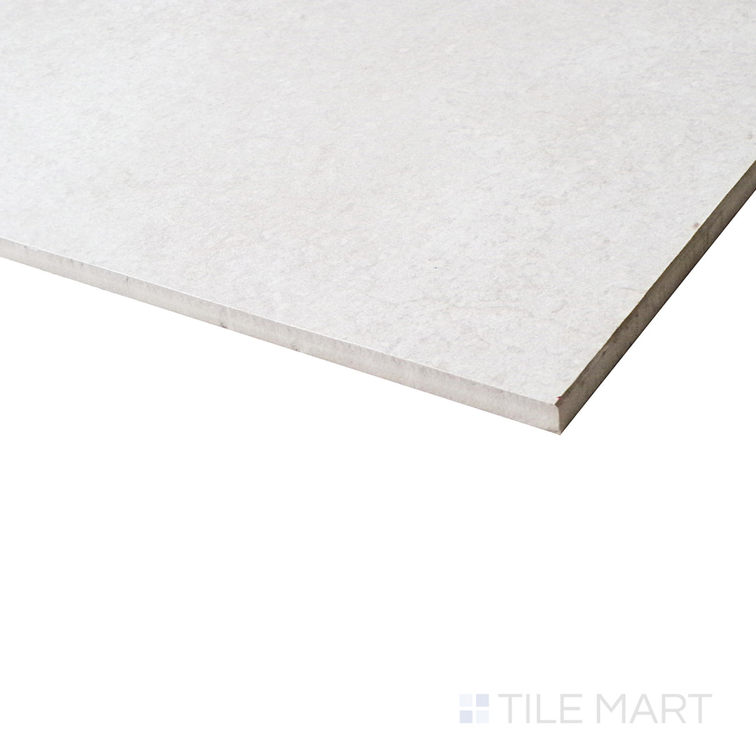 A refined perspective highlights the honed white porcelain surface, enhancing the minimalistic and clean aesthetic.