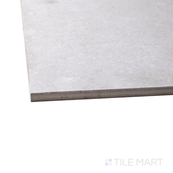 A corner perspective of the Brooklyn Cemento White 24x48 honed porcelain tile emphasizes its crisp white tone and honed finish, creating a clean, modern, and sophisticated look.