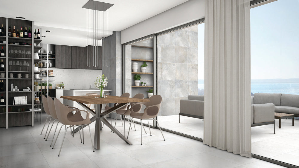 A bright and contemporary space highlighted by Brooklyn Cemento White 24X48 honed porcelain tiles, offering a refined and airy aesthetic with soft cement-inspired textures.
