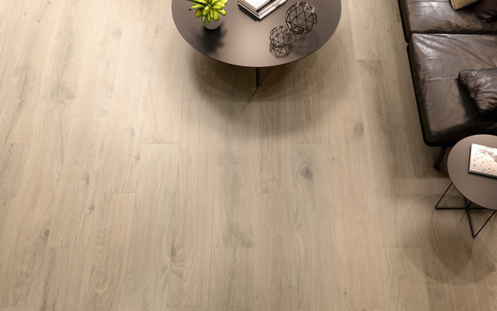 A warm and inviting setting featuring Century Wood Look Natural 9.84X59.1 matte porcelain tiles, capturing the essence of authentic wood with natural grains and textures.