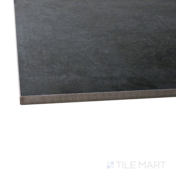 A corner shot of the Concrete Anthracite 48x48 matte porcelain tile highlights its deep charcoal tone and smooth matte surface, bringing a bold and industrial-inspired look to walls and floors.
