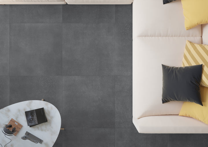 A sophisticated lifestyle image featuring Concrete Anthracite 48X48 matte porcelain, exuding bold character with deep, industrial-inspired hues.