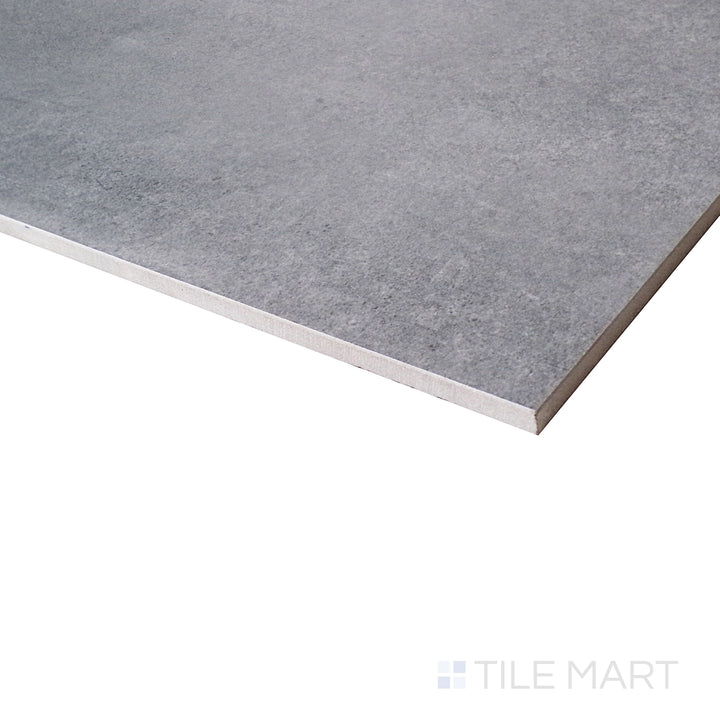 An angled close-up showcases the deep graphite shades, giving a sophisticated edge to this modern matte tile.