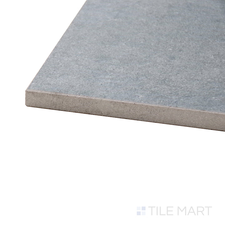 A corner perspective of the Concrete Graphite 48x48 matte porcelain tile emphasizes its cool graphite-gray tone and soft matte texture, creating a sleek and urban aesthetic.