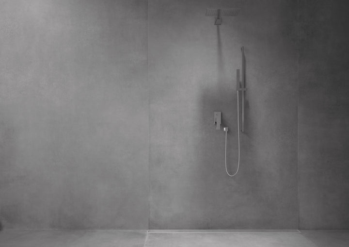 An elegant lifestyle shot of Concrete Graphite 48X48 matte porcelain, delivering a striking, modern look with deep, rich shading.