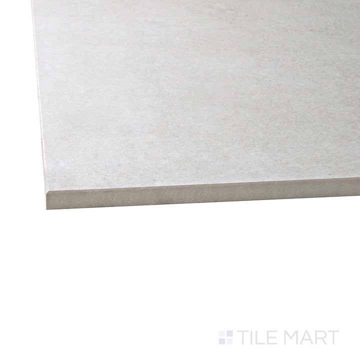 A corner shot of the Concrete Gray 48x48 matte porcelain tile highlights its neutral gray shade and fine cement-inspired texture, making it a versatile choice for contemporary spaces.