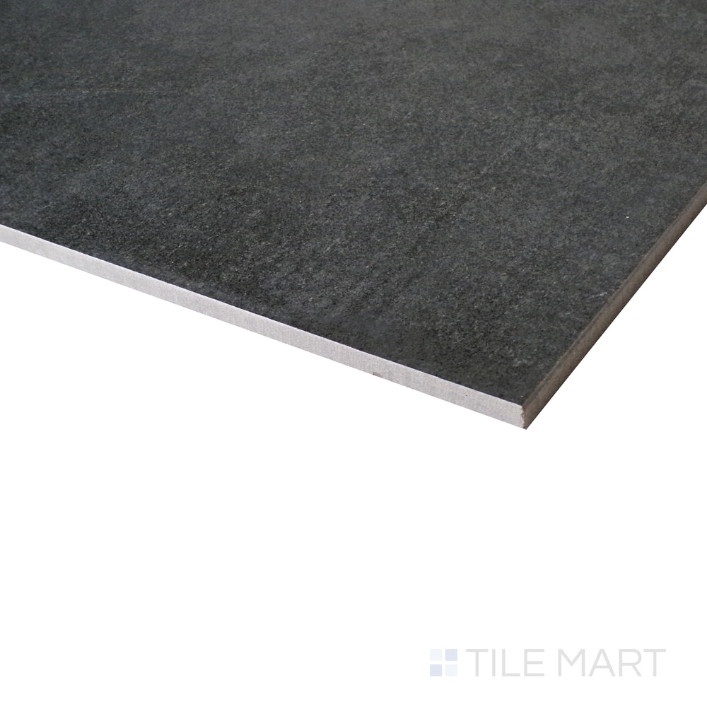 A close-up angle captures the industrial charm of the anthracite matte porcelain tile, emphasizing its raw elegance.