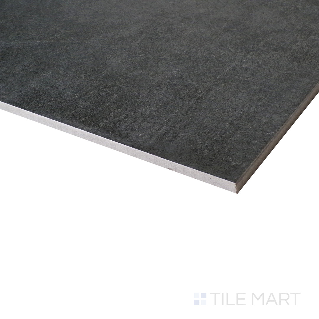 A close-up angle captures the industrial charm of the anthracite matte porcelain tile, emphasizing its raw elegance.