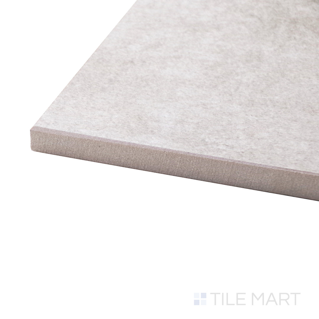 A corner perspective of the Concrete Beige 12x24 matte porcelain tile emphasizes its warm beige tone and subtle stone-like texture, offering a balanced and inviting look.