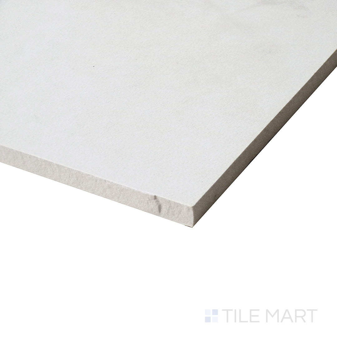 A close-up side view accentuates the honed matte surface, revealing the intricate details of the tile's natural-inspired texture.